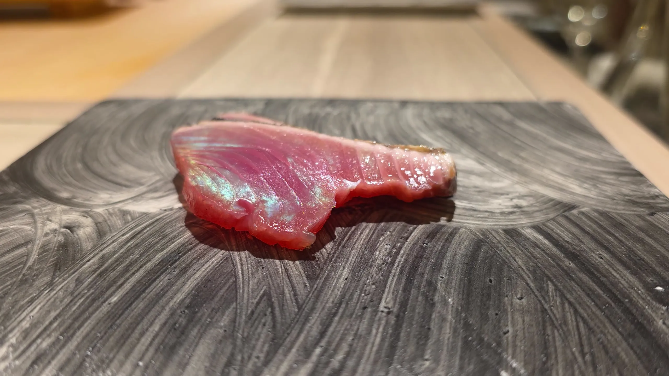 Seared modori-gatsuo on a slate plate at Shimazu